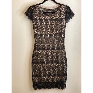 Nude fitted dress with black embroidery overlay